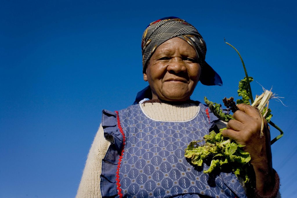 Woman grasping crops